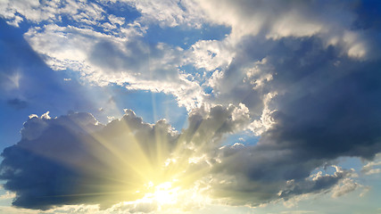 Image showing Sky background with dark clouds and sunlight