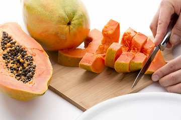 Image showing Cutting A Papaya Quarter Into Six Slices