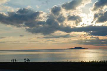 Image showing Bike silhouettes by the coast