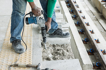 Image showing Worker breaking concrete