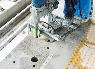 Image showing Worker drilling floor