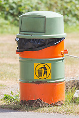 Image showing Old bin, green and orange