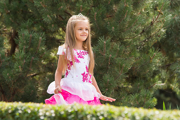 Image showing Girl in dress walking in the garden