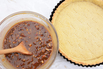 Image showing Making pecan pie - nutty pie filling and pie crust