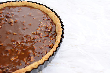 Image showing Pastry case filled with nutty pecan pie filling