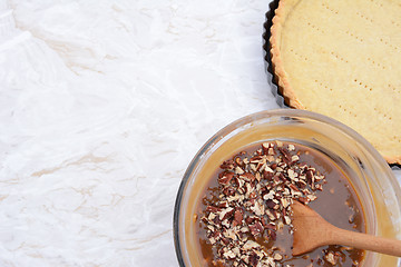 Image showing Baking pecan pie - pie filling and pastry crust