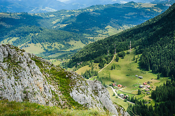 Image showing Single house on a meadow in mountains