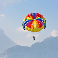 Image showing Parasailing in a blue sky near sea beach