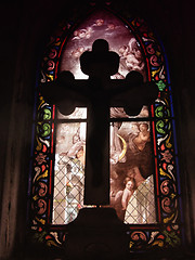 Image showing Cross in front of a stained glass