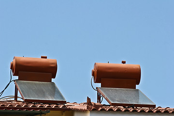 Image showing Solar pannels on a roof house in  Peloponese in greece in the su
