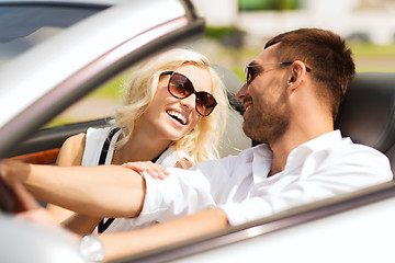 Image showing happy man and woman driving in cabriolet car