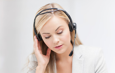 Image showing female helpline operator with laptop