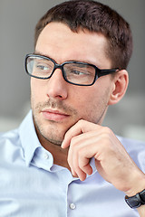 Image showing portrait of  businessman in eyeglasses at office