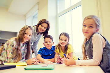 Image showing group of school kids writing test in classroom