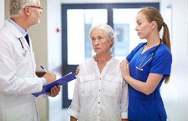 Image showing medics and senior patient woman at hospital