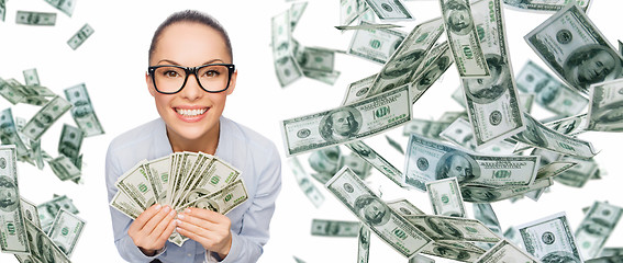 Image showing smiling businesswoman with dollar cash money