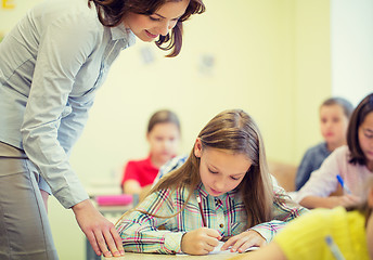 Image showing group of school kids writing test in classroom