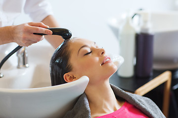 Image showing happy young woman at hair salon