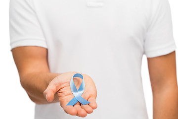 Image showing hand with blue prostate cancer awareness ribbon