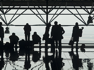 Image showing Silhouettes of travellers