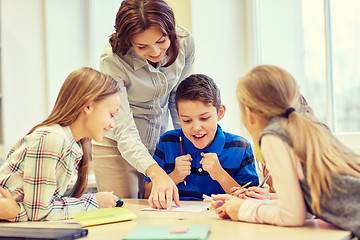 Image showing group of school kids writing test in classroom