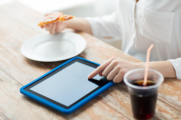 Image showing close up of woman with tablet pc counting calories