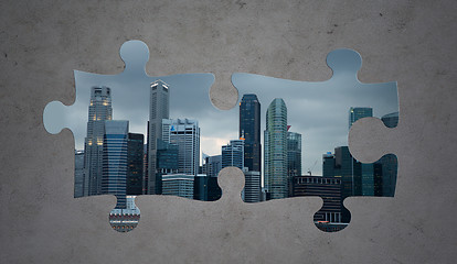 Image showing puzzle of city over gray concrete background