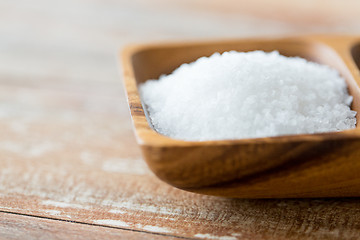 Image showing close up of white salt heap in wooden bowl