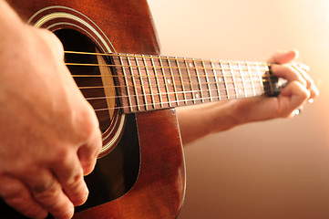 Image showing Person playing a guitar