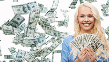 Image showing smiling businesswoman with dollar cash money