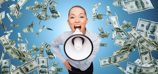 Image showing screaming businesswoman with megaphone and money