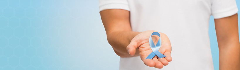 Image showing hand with blue prostate cancer awareness ribbon