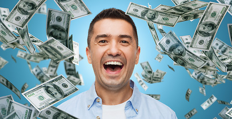 Image showing laughing man with falling dollar money