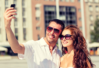 Image showing smiling couple in city