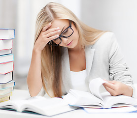 Image showing student with books and notes