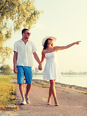 Image showing smiling couple walking outdoors