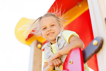 Image showing happy little girl climbing on children playground