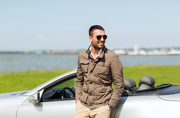 Image showing happy man near cabriolet car outdoors