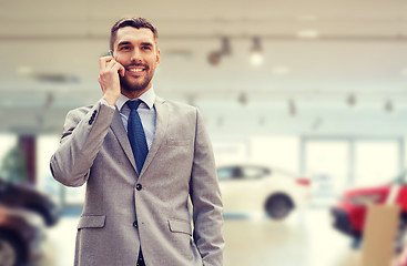 Image showing smiling businessman talking on smartphone