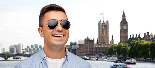 Image showing face of smiling man in shirt and sunglasses