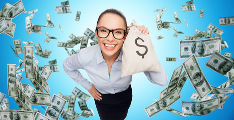 Image showing smiling businesswoman with dollar cash money