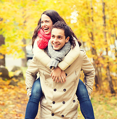 Image showing smiling friends having fun in autumn park