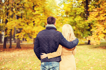 Image showing couple hugging in autumn park from back