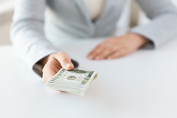 Image showing close up of woman hands holding us dollar money