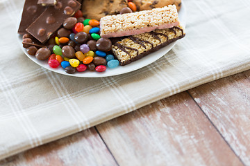 Image showing close up of candies, chocolate, muesli and cookies