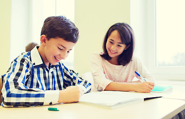 Image showing group of school kids writing test in classroom