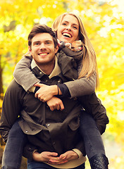 Image showing smiling friends having fun in autumn park