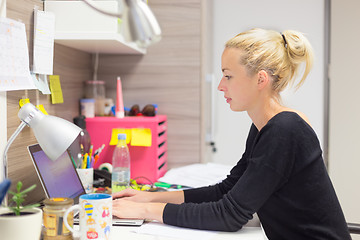 Image showing Businesswoman working on computer in office.