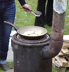 Image showing Frying pancakes 