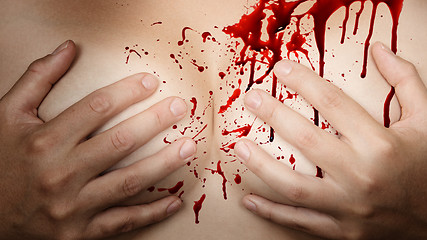 Image showing Hands covering breasts - Blood